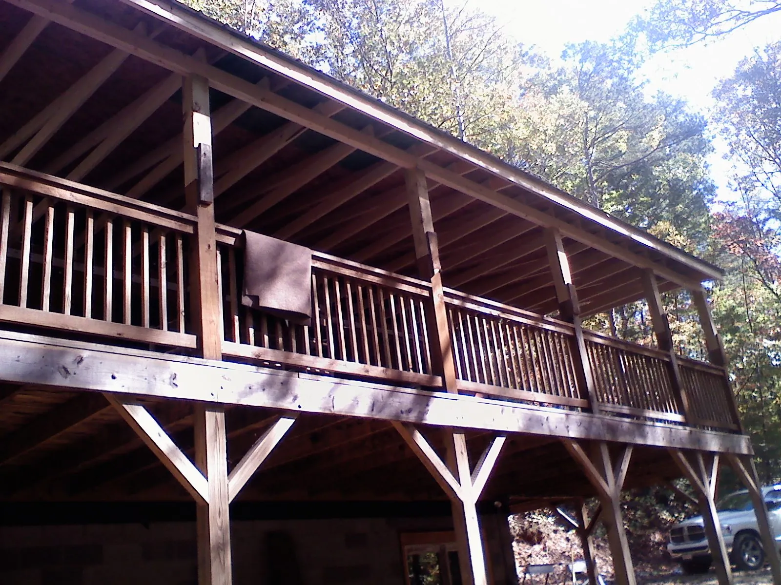 Timber framing under a new elevated porch and deck — Roof Leak Repair in Laura by Roofing Brothers